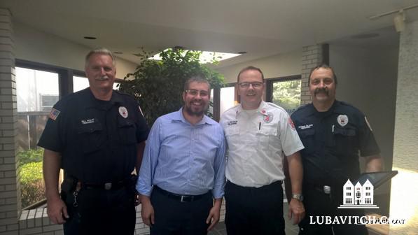 Rabbi Susskind meets with the Fire Marshall to ensure that the building is up to code. (Photo: Carey Goldberg)